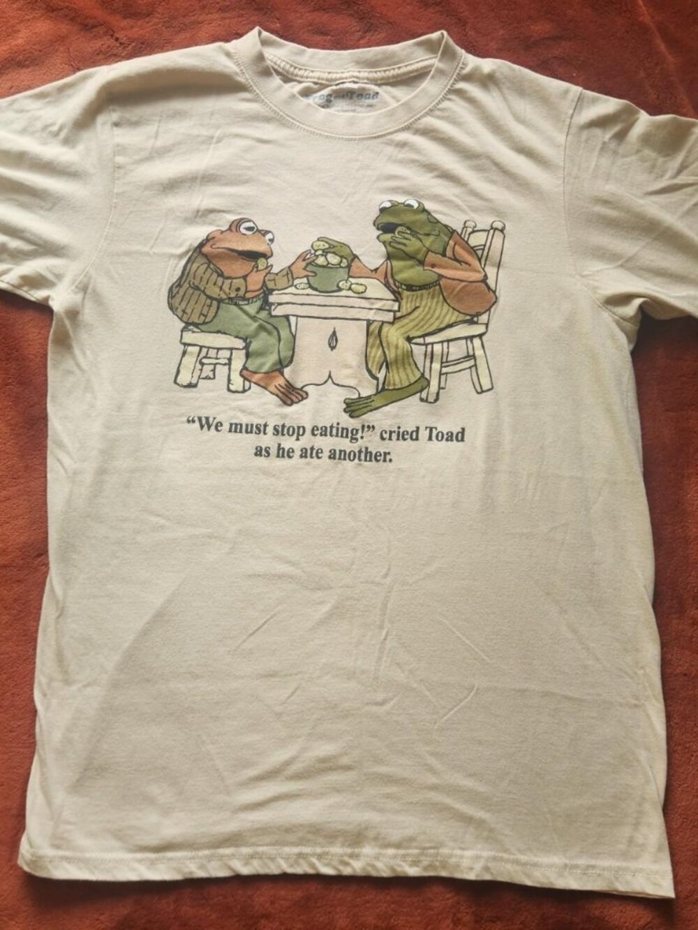 Frog & Toad "We Must Stop Eating" khaki/tan short sleeve graphic t-shirt. Size M